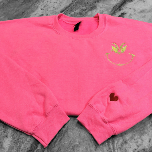 Christmas Grinch Face + Heart Sleeve Safety Pink Embroidered Crewneck Sweatshirt